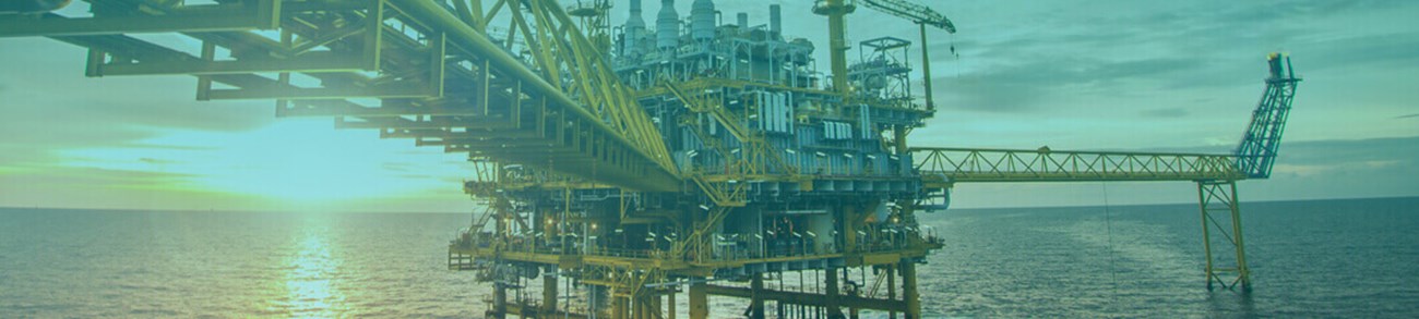  Offshore oil and rig platform in sunset or sunrise time. Construction of production process in the sea. Power energy of the world.