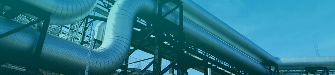 Industrial zone, Steel pipelines and valves against blue sky